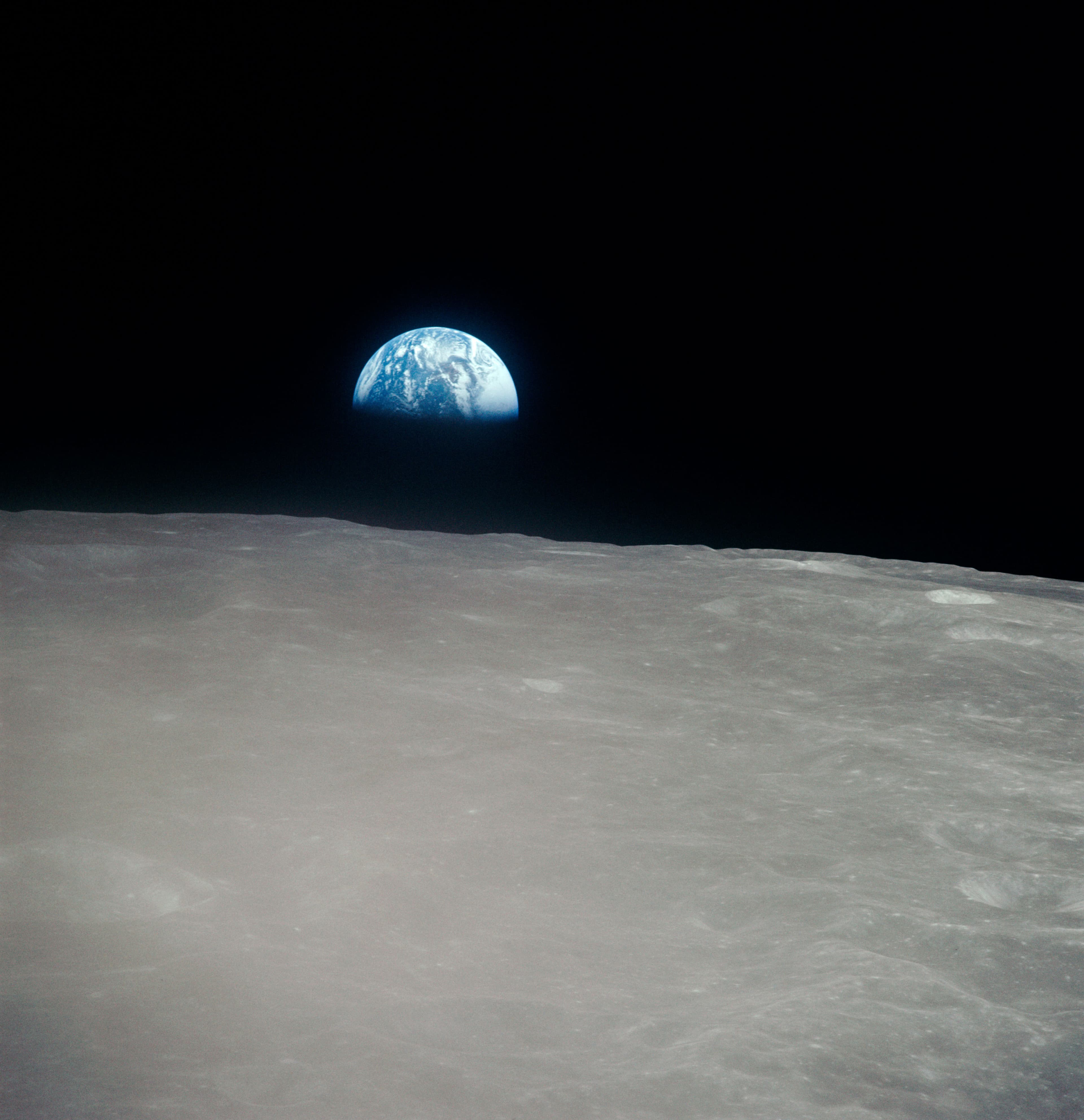 AS16-120-19187 - Apollo 16 - Apollo 16 Mission image - Earth rise scene taken during the second revolution of the moon.